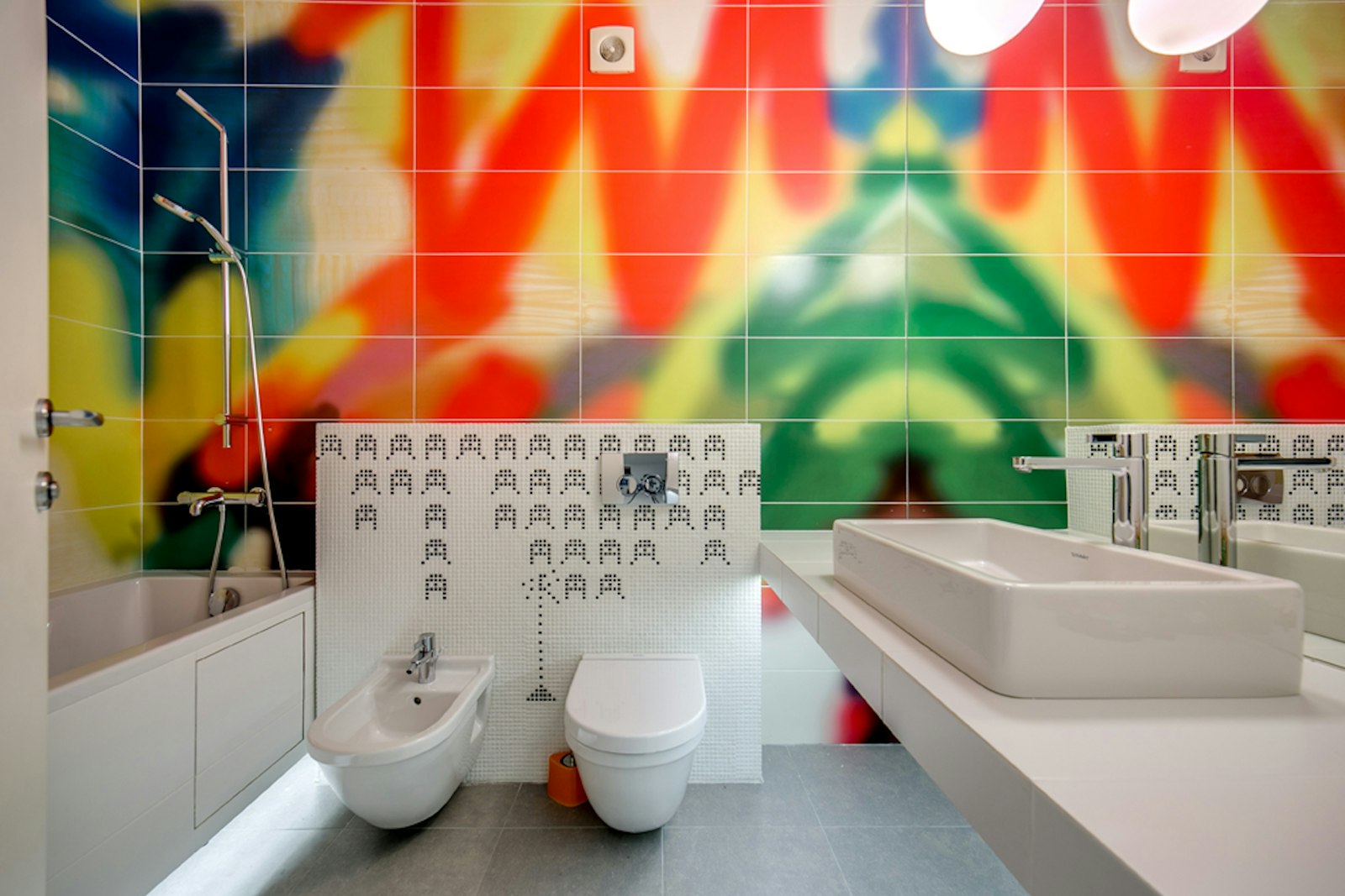 Clean, modern family bathroom with bright lighting and a white toilet